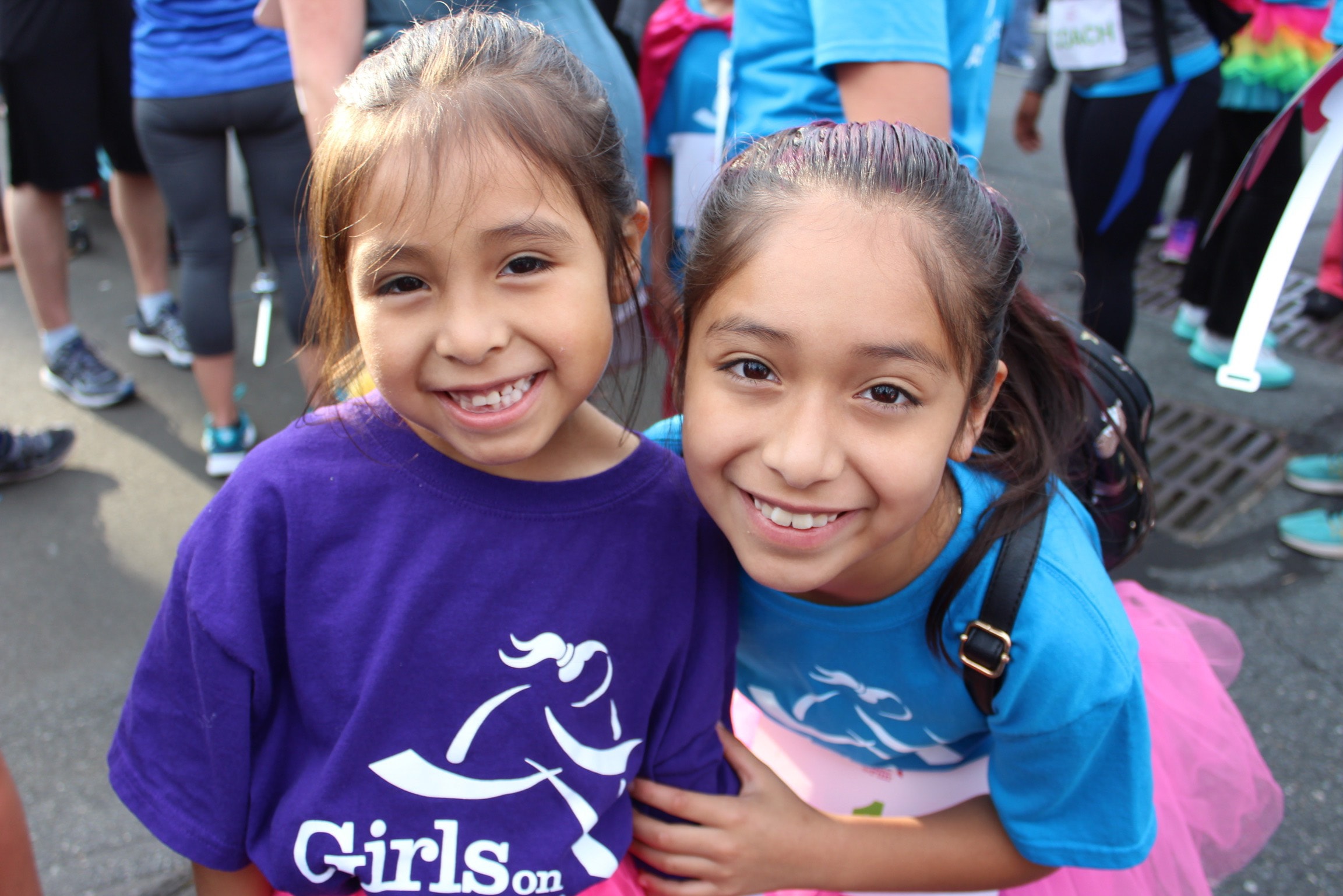 Two Girls on the Run participants smile at 5K celebration 